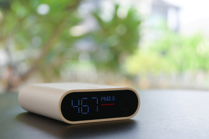 Image of a digital clock in front of a window