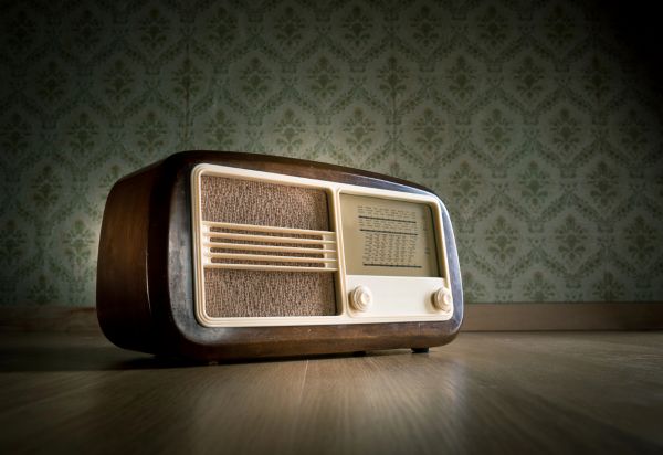 Image of an old radio on a wood floor